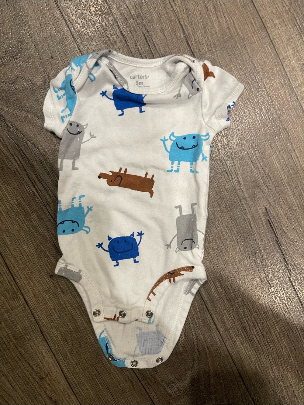 Carter's White One-Piece with Blue, Gray and Brown Monster Print